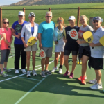 View of Red Ledges Club members holding paddle ball paddles